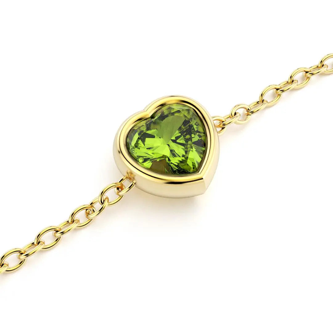 bracelet byzance pour femme forme coeur en or jaune avec peridot