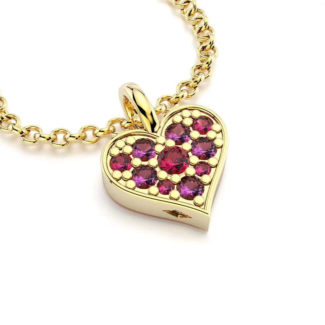 Collier coeur en or jaune avec saphirs magenta et rubis