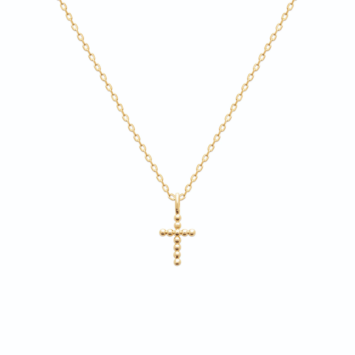 Pendentif croix perlée en plaqué or vu de profil