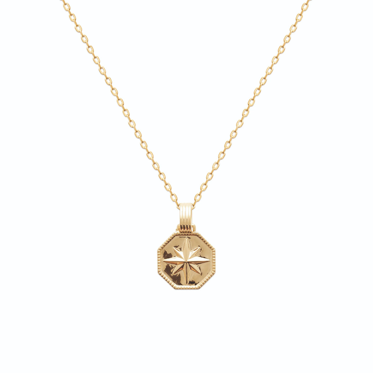 Pendentif médaille octogonale rose des vents en plaqué or vu de profil