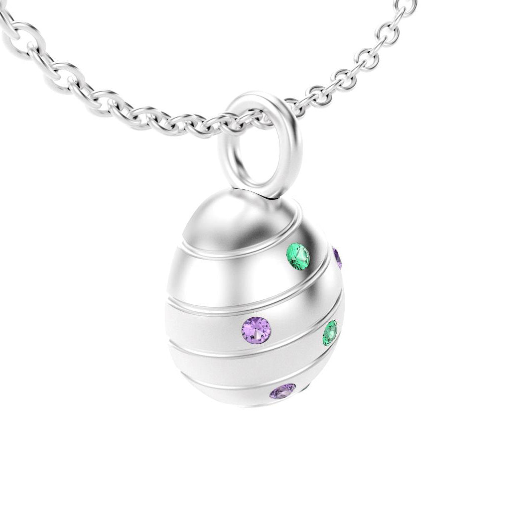 pendentif oeuf pour femme en argent avec saphirs violet et emeraude