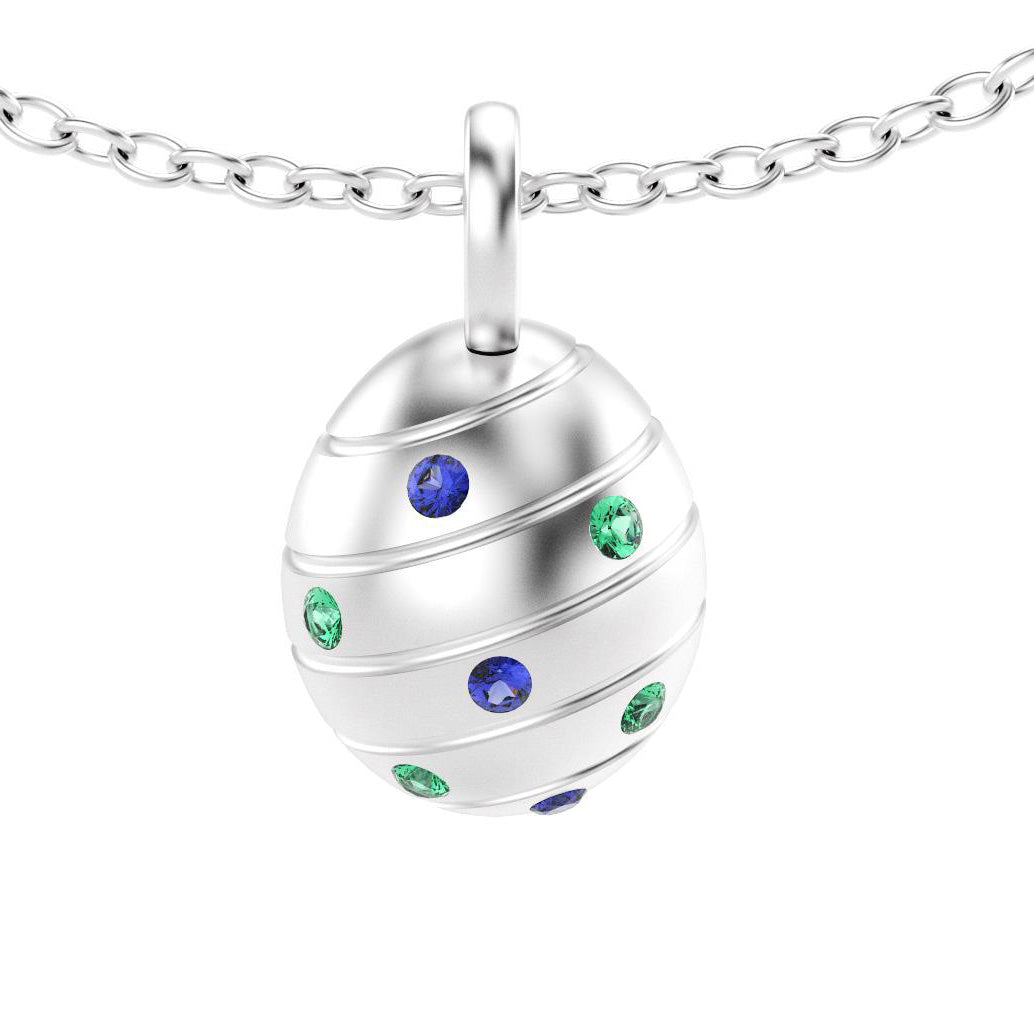 pendentif oeuf pour femme en argent avec saphirs bleus et emeraudes