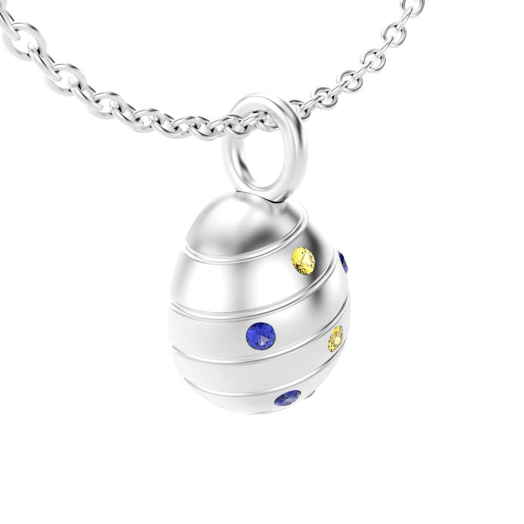 pendentif oeuf pour femme en argent avec saphirs bleus et saphirs jaune