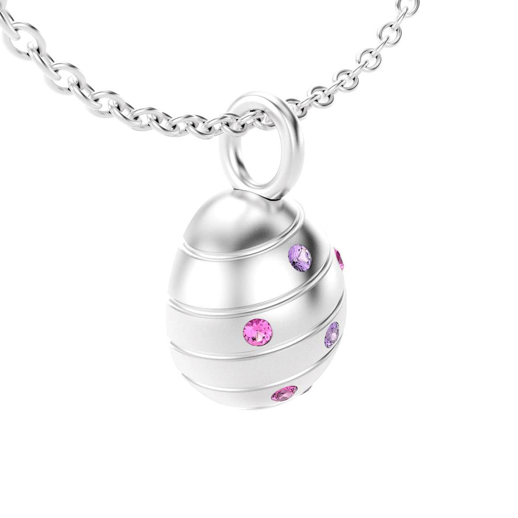 pendentif oeuf pour femme en or blanc avec saphirs roses et saphirs violet