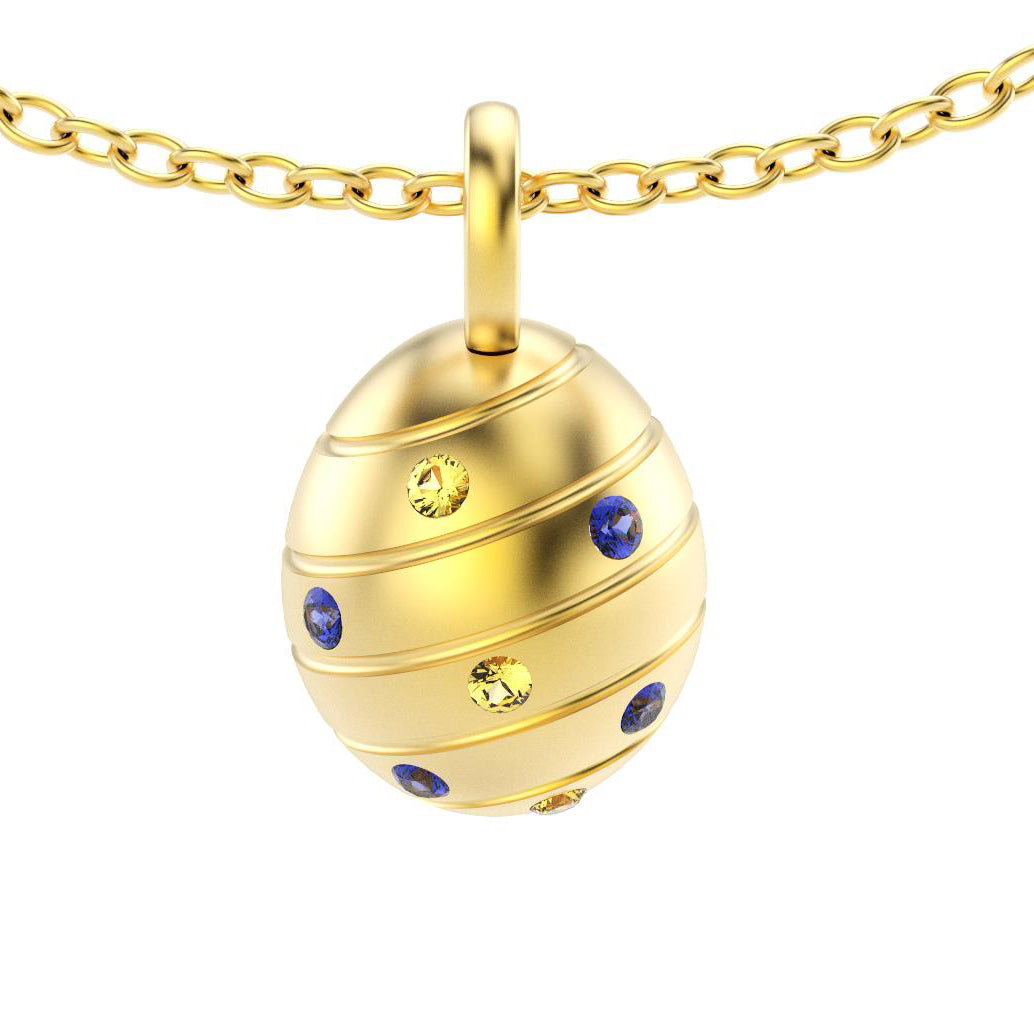 pendentif oeuf pour femme en or jaune avec saphirs bleus et saphirs jaune