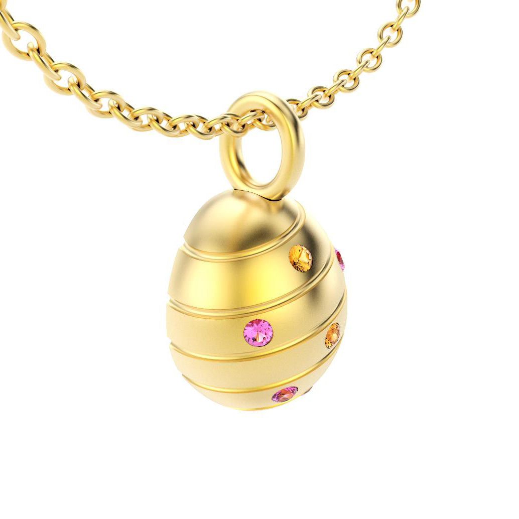 pendentif oeuf pour femme en or jaune avec saphirs roses et mandarin