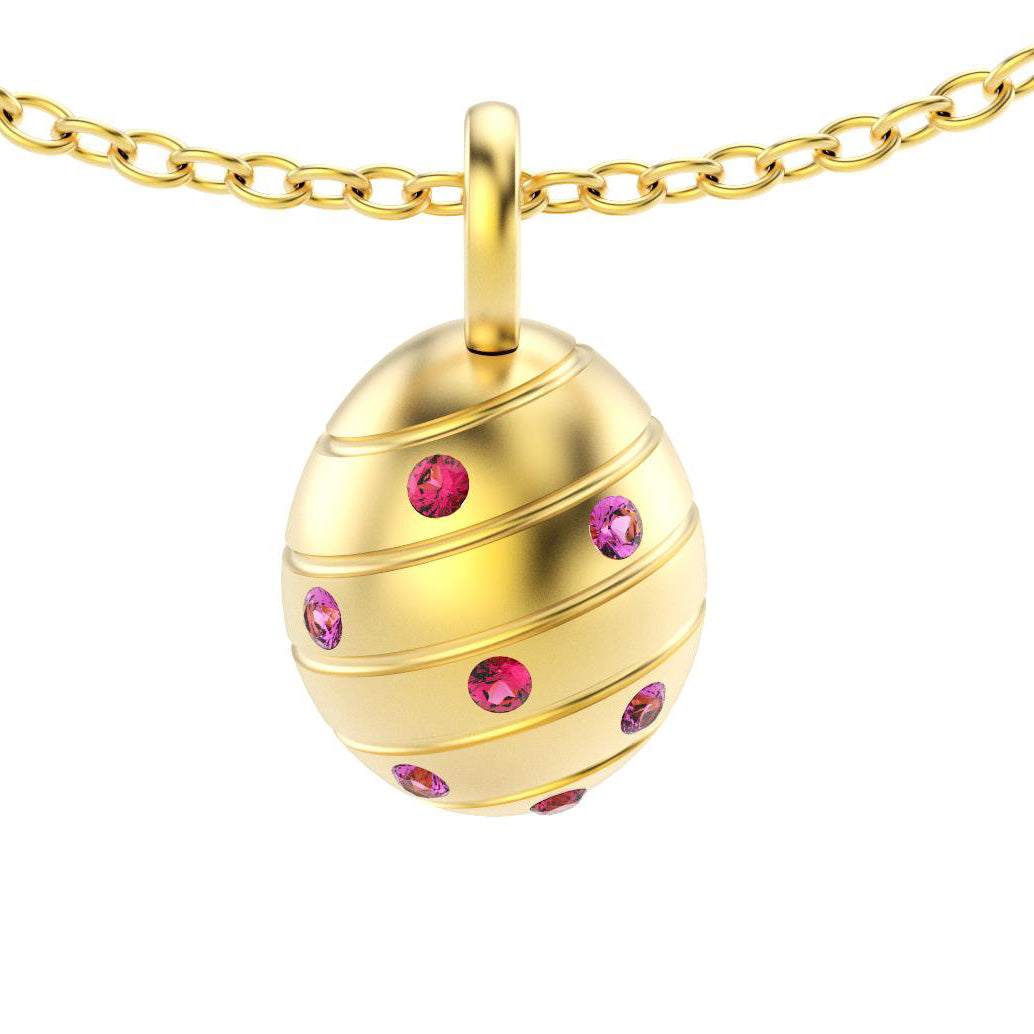 pendentif oeuf pour femme en or jaune avec saphirs violet et rubis