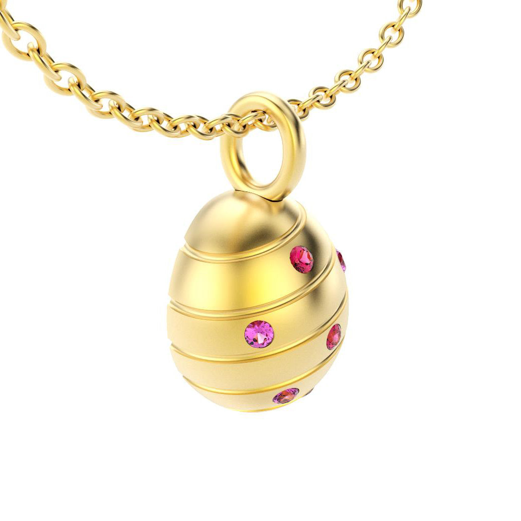 pendentif oeuf pour femme en or jaune avec saphirs violet et rubis