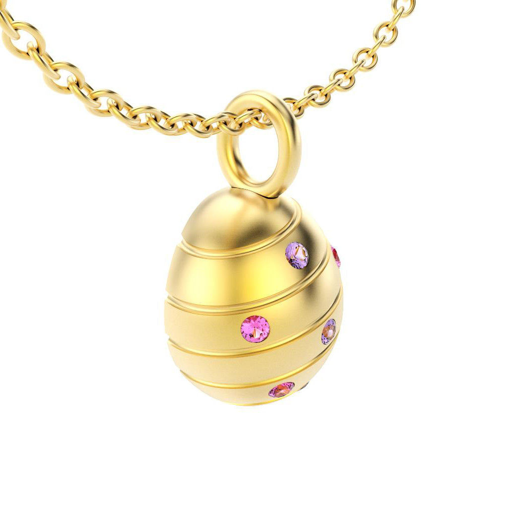 pendentif oeuf pour femme en or jaune avec saphirs violet et saphirs roses