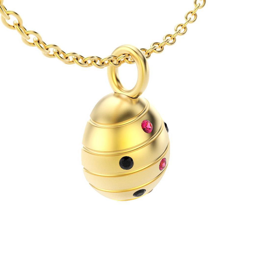 pendentif oeuf pour femme en or jaune avec spinelles noires et rubis