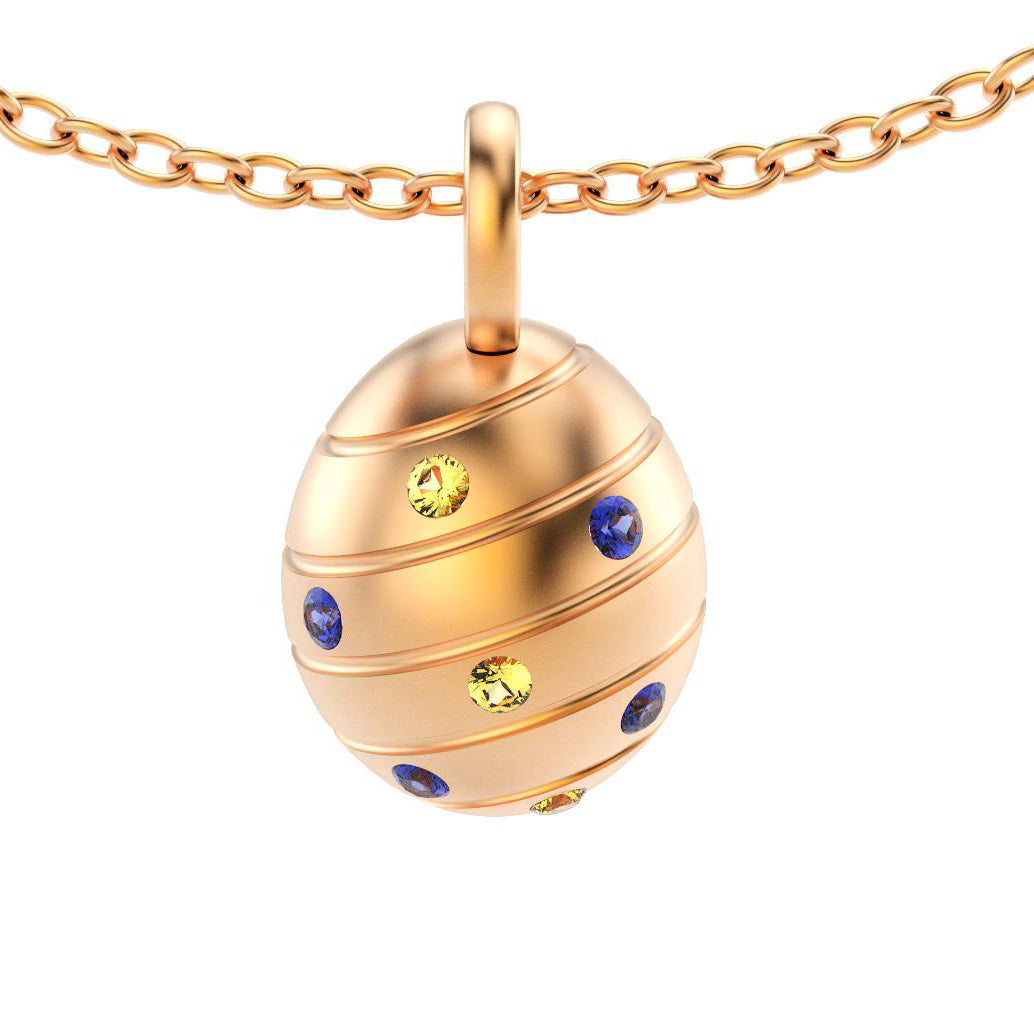 pendentif oeuf pour femme en or rose avec saphirs bleus et saphirs jaune