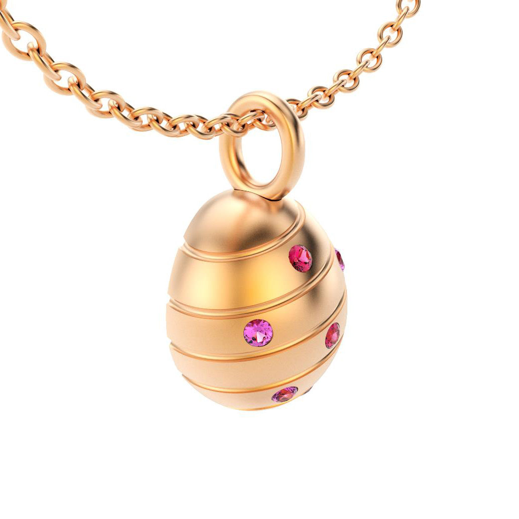 pendentif oeuf pour femme en or rose avec saphirs violet et rubis
