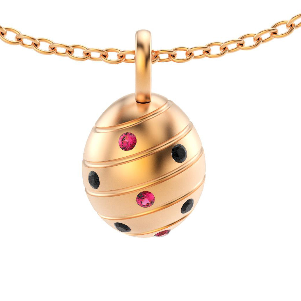 pendentif oeuf pour femme en or rose avec spinelles noires et rubis