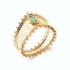Bague bandeau soleil ajouré de rayons perlés et pierre navette verte en plaqué or