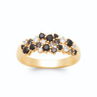 Bague bombée grappe de pierres noires et zircons plaqué or, vue de face