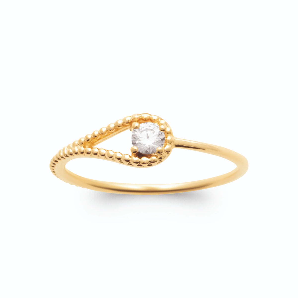 Bague boucle en goutte de fil perlé enserrant un zircon en plaqué or