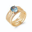 Bague cinq anneaux perlés et pavés et pierre ovale bleu ciel en plaqué or