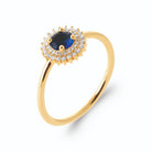 Bague double entourage de zircons et pierre ronde bleu nuit en plaqué or