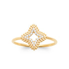 Bague étoile à quatre branches pavée de zircons et grains d’or plaqué or, vue de face