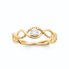 Bague fils d’or entrelacés en vagues lisses et perlés zircon en plaqué or
