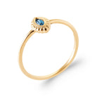 Bague fine solitaire pierre navette bleu profond cadre perlé en plaqué or