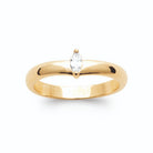 Bague jonc bombé et zircon navette serti clos en plaqué or