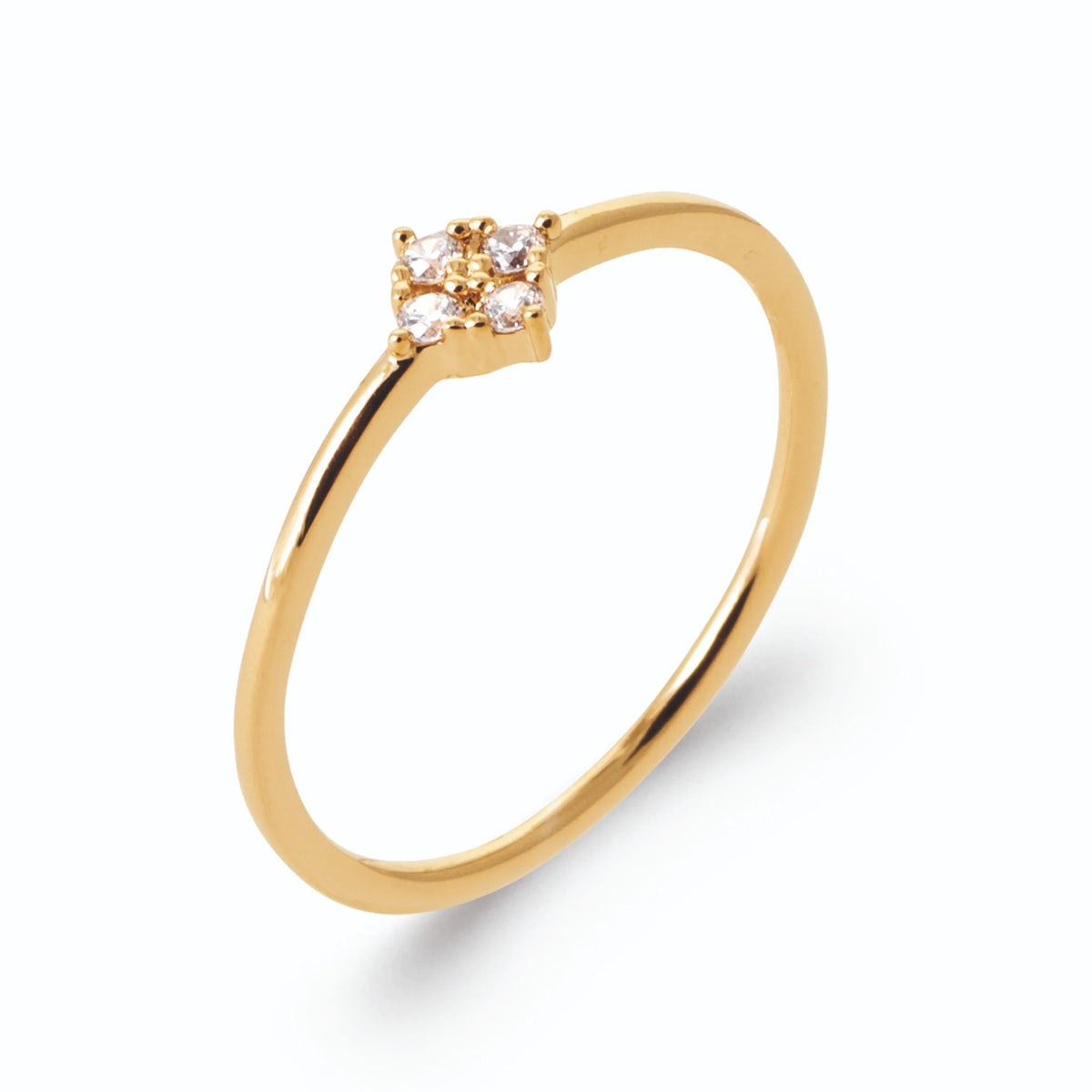 Bague losange de quatre petits zircons sur anneau fin en plaqué or