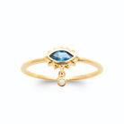 Bague œil navette bleue à cils rayonnants et pampille en plaqué or