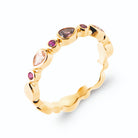 Bague ondulée pierres rose et fuchsia en plaqué or, vue de trois quarts