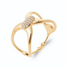 Bague ouverte croisée et barrette pavée de zircons en plaqué or, vue de trois quarts