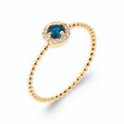 Bague pierre bleu nuit entourée de zircons et anneau perlé en plaqué or