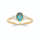 Bague pierre ovale bleu canard et trios de zircons en plaqué or