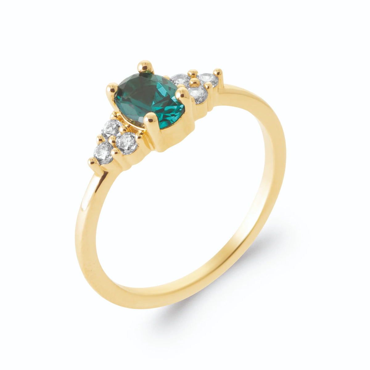Bague pierre ovale bleu canard et trios de zircons en plaqué or