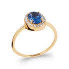 Bague pierre ovale bleu nuit entourage de zircons et anneau fin en plaqué or