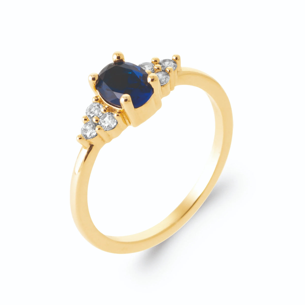 Bague pierre ovale bleu nuit et trios de zircons en plaqué or