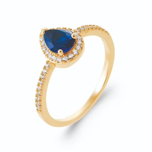Bague pierre poire bleu nuit et entourage de zircons en plaqué or, vue de trois quarts