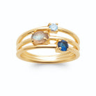 Bague quatre anneaux fins et pierres grises et bleues en plaqué or