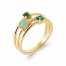 Bague quatre anneaux fins et pierres vertes en plaqué or