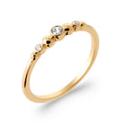 Bague rangée de billes d’or et zircon serti clos en plaqué or