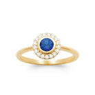 Bague ronde bleu outremer serti clos entourage de zircons en plaqué or