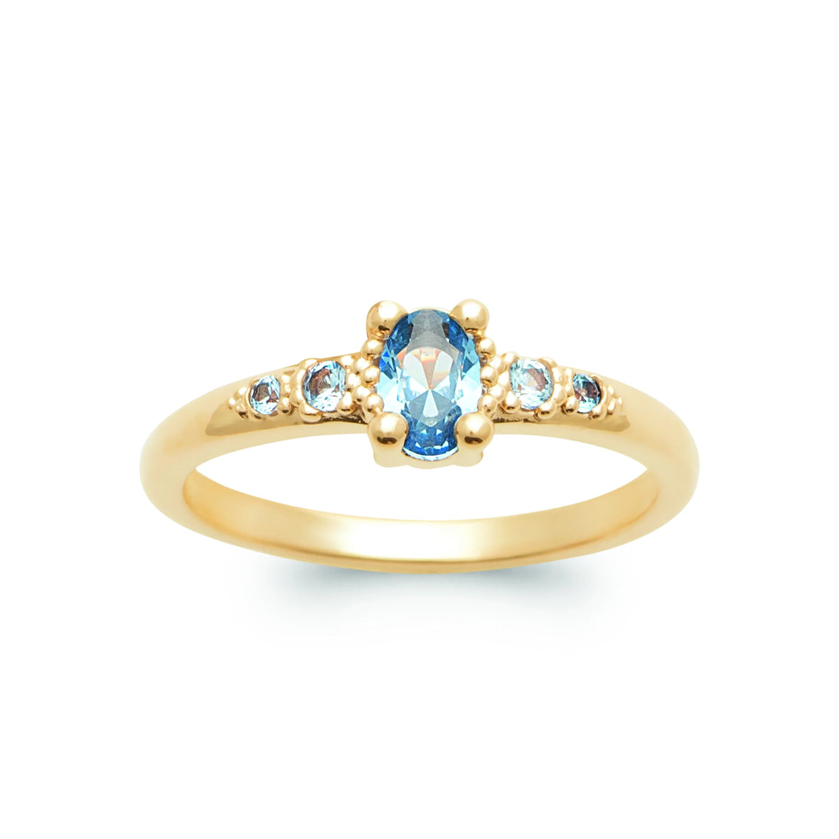 Bague solitaire pierre ovale bleu ciel et petites pierres bleues plaqué or, vue de face