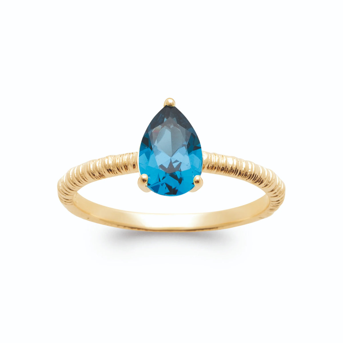 Bague solitaire poire bleu profond sur anneau strié en plaqué or