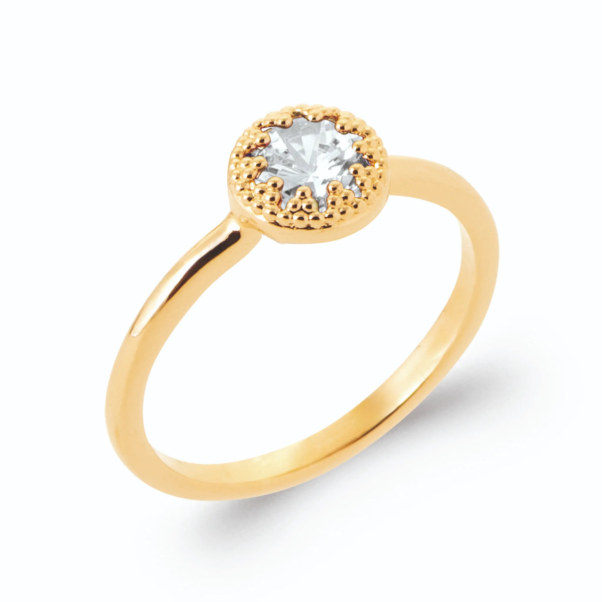 Bague solitaire zircon rond collerette perlée en plaqué or, vue de trois quarts