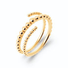 Bague spirale deux tours en billes d’or dégradées en plaqué or, vue de trois quarts