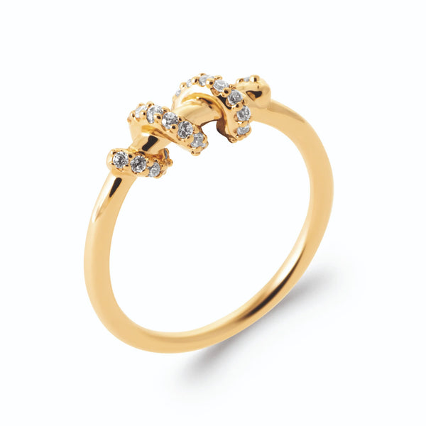 Bague spirale de fil d’or ponctuée de zircons en plaqué or, vue de trois quarts