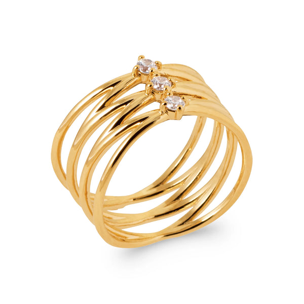 Bague spirale multi-tours en fil d’or lisse et trois zircons en plaqué or, vue de trois quarts