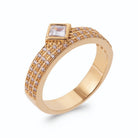 Bague trois rangs pavés de zircons et zircon carré serti clos en plaqué or