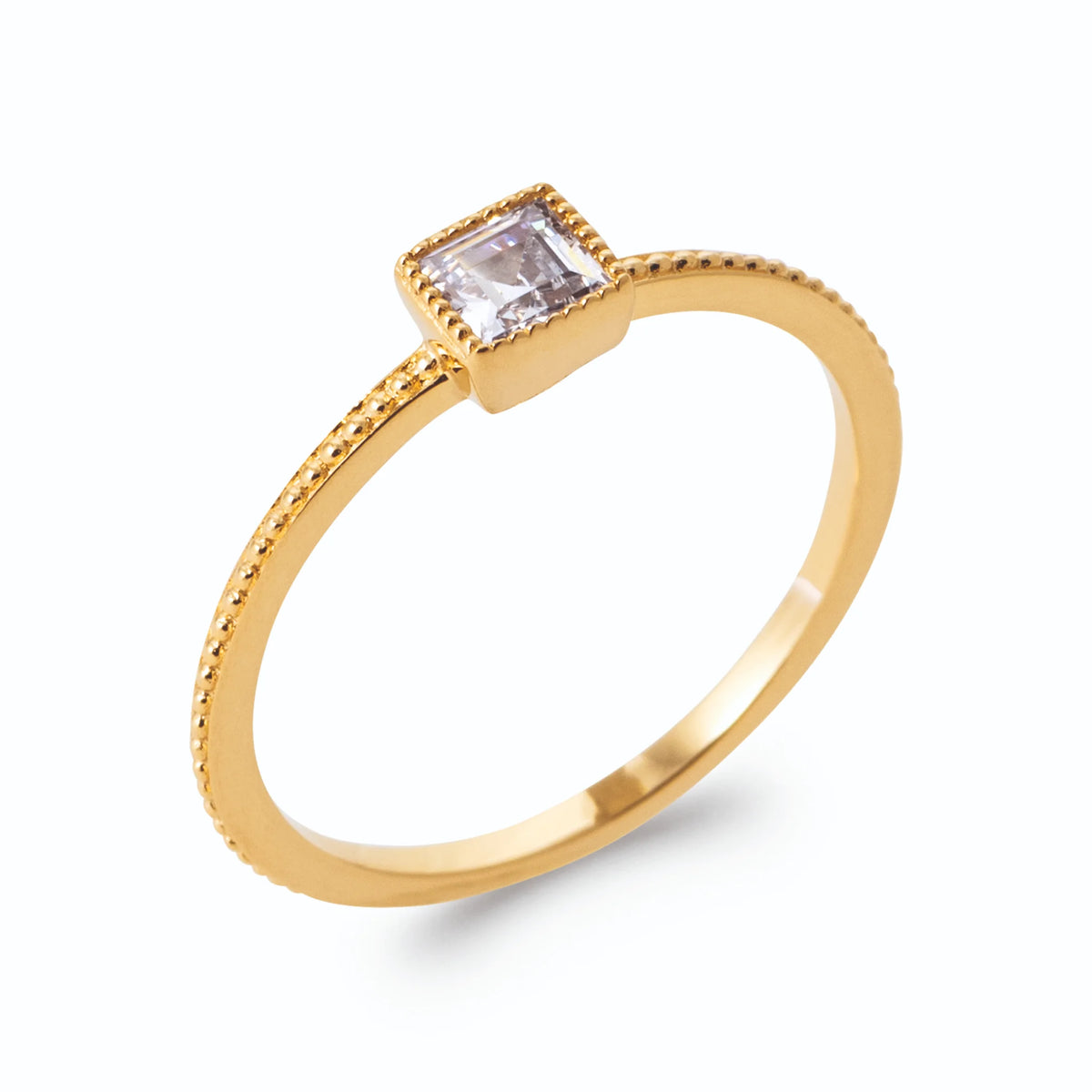 Bague zircon carré en serti clos sur anneau perlé en plaqué or