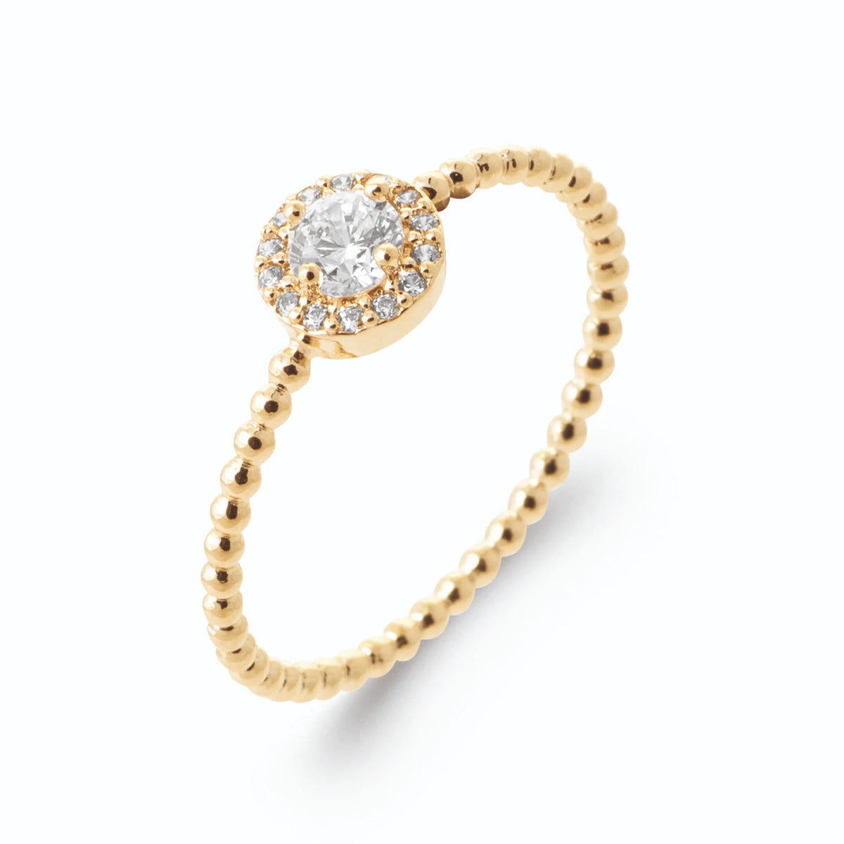 Bague zircon rond entouré et anneau perlé de billes d’or en plaqué or, vue de trois quarts