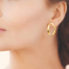 Boucles d’oreilles anneau ovale vrillé en acier PVD doré